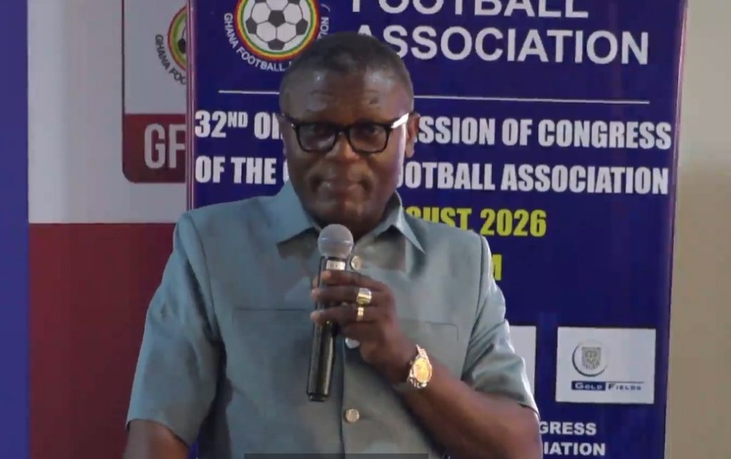 Minority Questions Continued Stay of Sports Minister’s Driver and Secretary in USA
